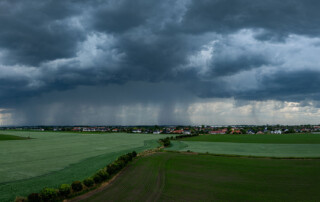severe weather water damage, view of a storm approaching town in the upper midwest